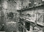 Illustrazione num. 64: "Chiese distrutte dallo sventramento di via dell'Impero. Demolizione della chiesa di S. Adriano nella Curia del Senato (1932-37). Il bellissimo interno barocco, e la sua demolizione".